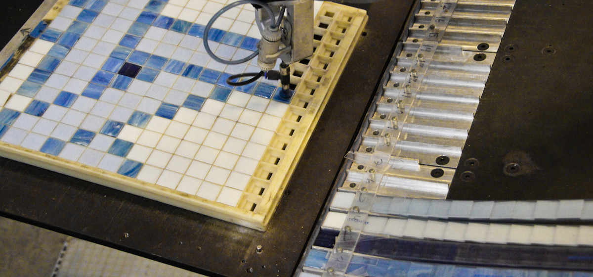 robot producing blue arabesque geometric mosaic tile design by artaic - lombardi residential pool